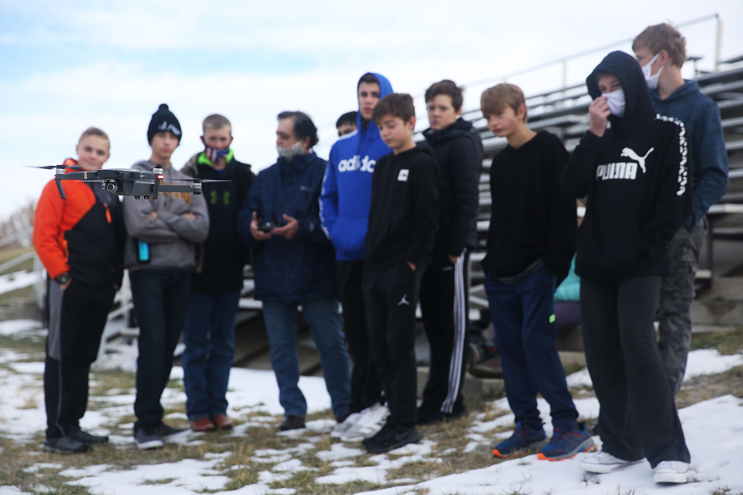 The drone hovers above the ground as teacher Rick Sanchez explains how to launch